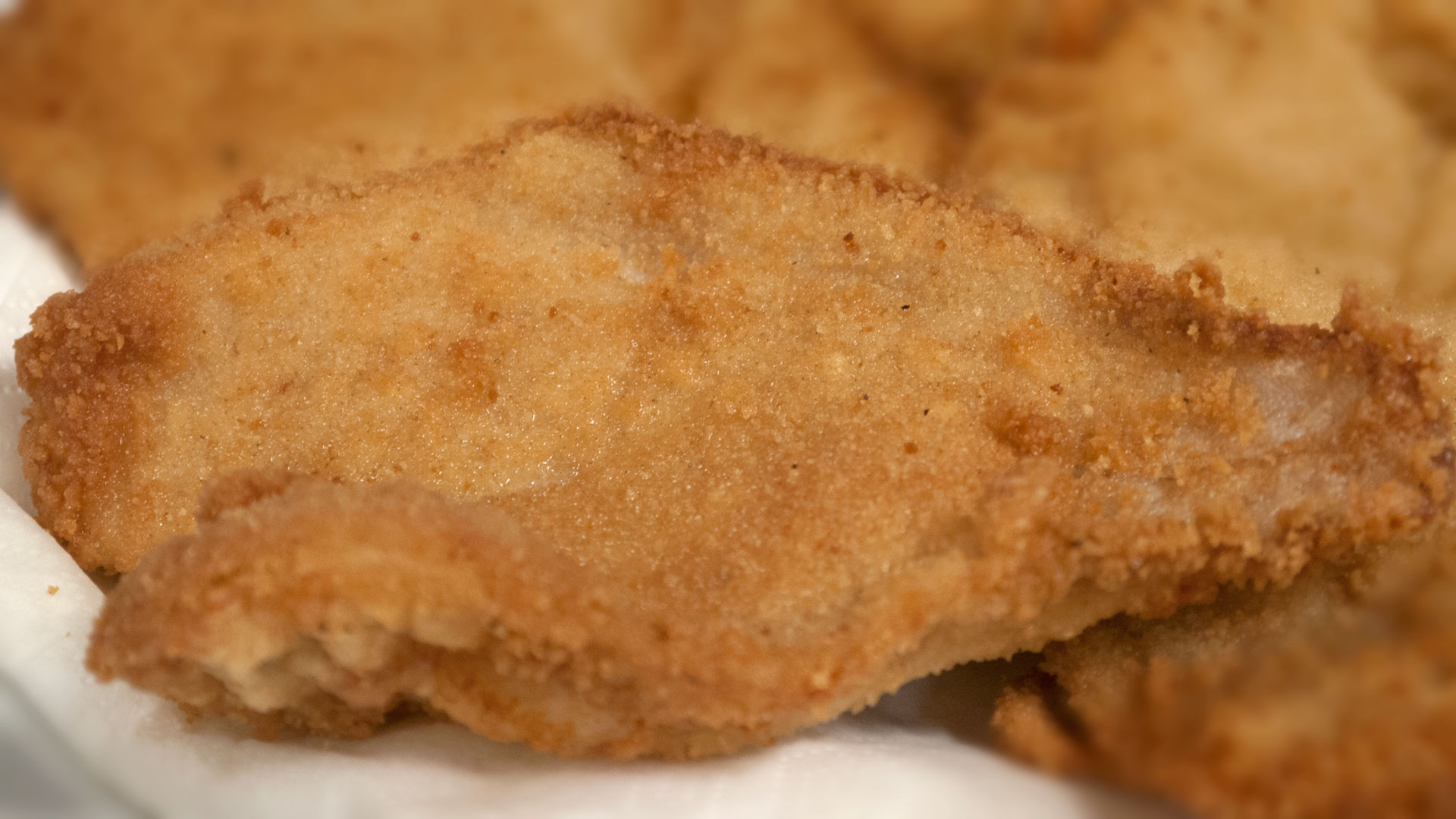 Deep-fried fish fillets - double-breaded with beignet batter and breadcrumbs