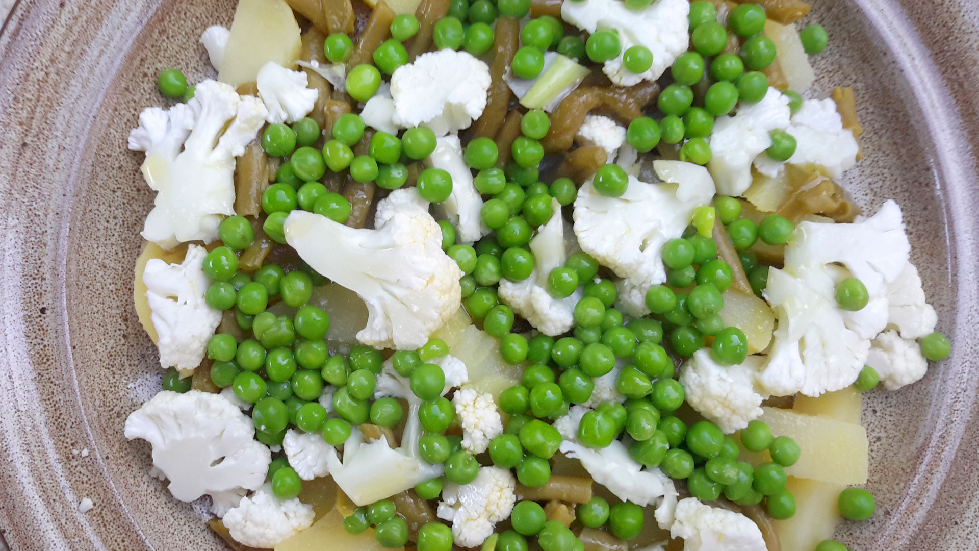 Legumes (vegetables) - salad with potatoes, beans, peas and cauliflower